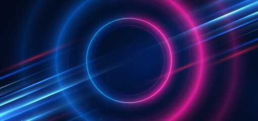 Abstract technology futuristic neon circle glowing blue and pink  light lines with speed motion blur effect on dark blue background. © Pramote