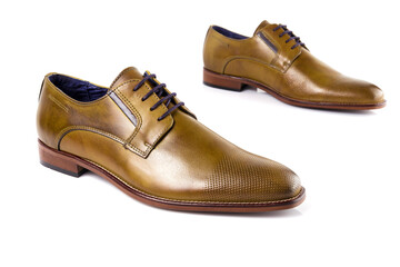 Male brown leather shoes on white background, isolated product. Differentiated footwear and exclusive design.