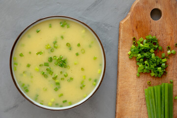 Homemade Potato Leek Soup in a Bowl on a gray background, top view. Flat lay, overhead, from above.