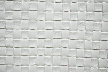 White leather woven texture background. White braided leather texture. White texture for background.