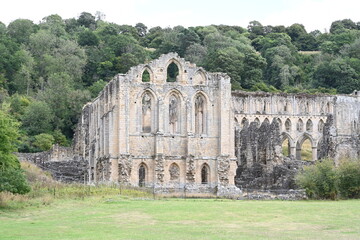 Fototapeta premium Rievaulx Abbey ree-VOH was a Cistercian abbey in Rievaulx, situated near Helmsley in the North York Moors National Park, North Yorkshire, England