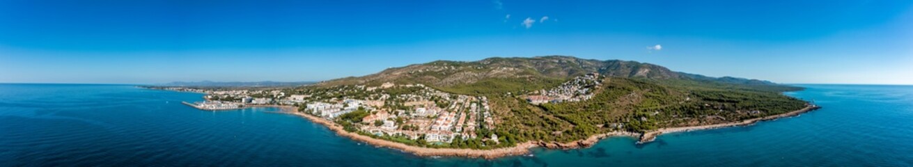 Fototapeta na wymiar Panoramic view of the beach town of Alcossebre, Spain from the mediterranean sea