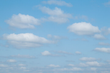 Blue sky background and white clouds soft focus, pastel sky.