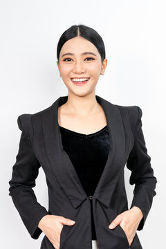 Portrait photo of a young beautiful classy and elegant asian businesswoman in black business suit with friendly nice smile and pose