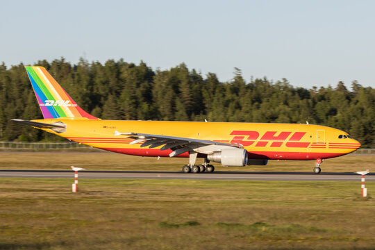 A DHL Airbus A300 cargo aircraft on the ground at Oslo Airport with rainbow flag on tail