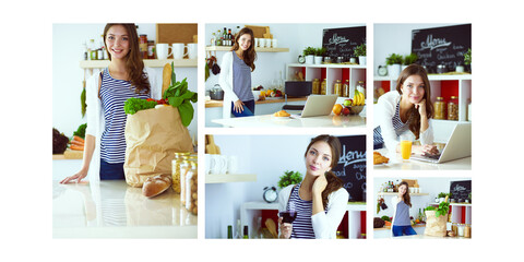 Young woman holding grocery shopping bag with vegetables .Standing in the kitchen. Young woman