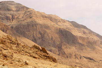 Fototapeta na wymiar Mountains and rocks in the Judean Desert in the territory of Israel.