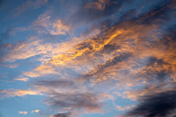 beautiful tropical sunset. gold painted clouds