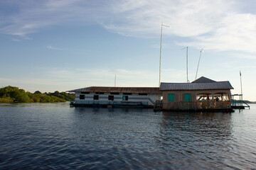 Houseboat on the amazon river, brazilian amazon rainforest