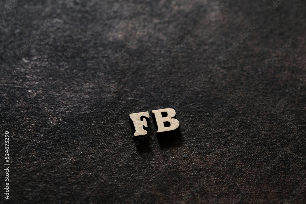 Poster the letters f and b above the dark field. initials fb