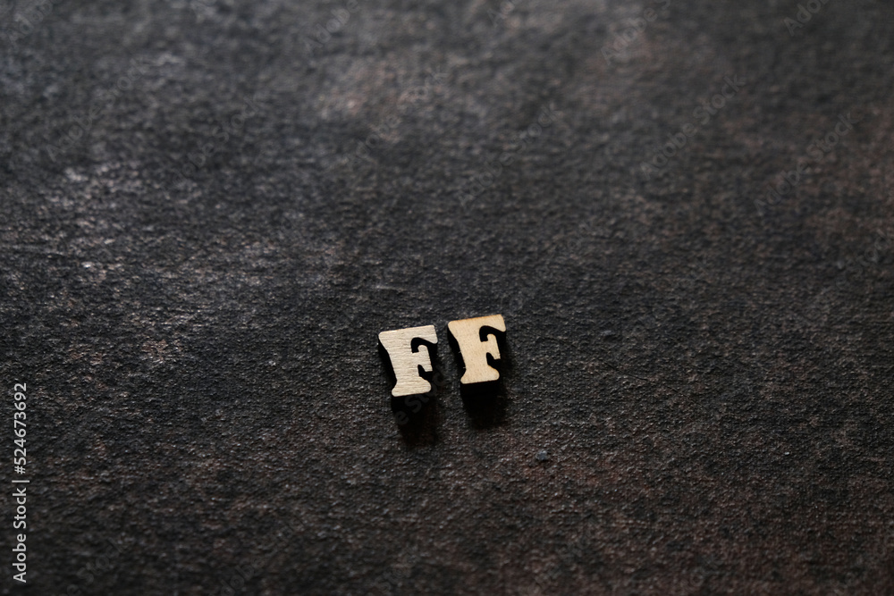 Poster the letters f and f above the dark field. initials ff