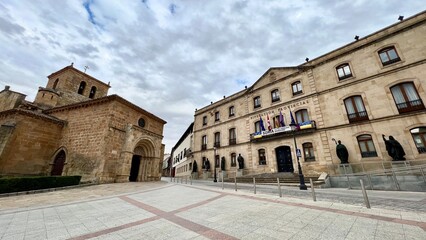 Fototapeta na wymiar SORIA,SPAIN - JUNE 25, 2022 -View at the Provincial Administration Palace with San Juan de Rabanera church in Soria.