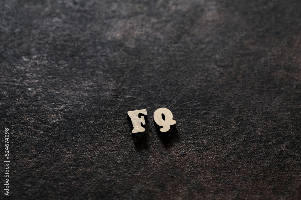 Wall mural the letters f and q above the dark field. initials fq