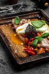 Keto breakfast poached egg and fried bacon. keto diet food. vertical image. top view. place for text