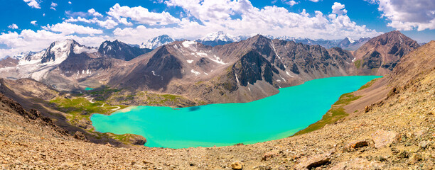 Mountain blue lake among the rocks. Beautiful landscape. Wonderful nature. Long banner, panoramic view