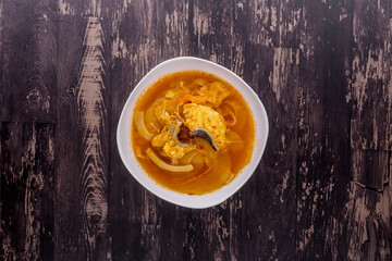 Yellow hot sour soup with preserved bamboo shoot and fish