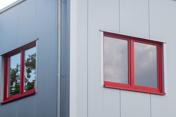 Fototapeta premium red and white windows at a modern building