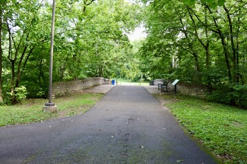 The walkway over the bridge in the park.