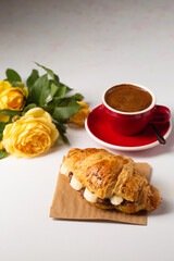 crispy croissant with peanut butter, banana and aromatic coffee