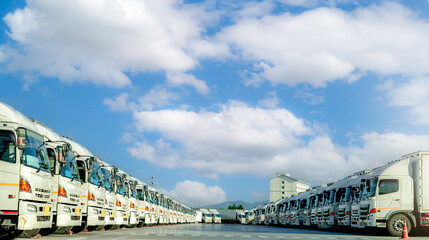 Fleet of trucks parked at parking lot yard of delivery company. Truck transport. Logistic industry....