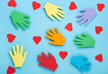 International Day of Charity, 5 September. Colorful Hands on Blue Background.