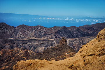 Mountain landscape panorama on the island Gran Canaria with ocean and sky on the background - breathtaking view higher than clouds