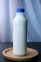 fresh milk in a plastic bottle on table 