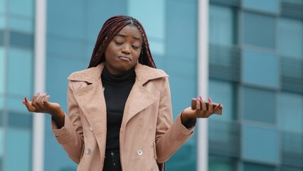 Upset frustrated young woman receiving email reading bad news on smartphone receives notice disapproval bank loan failed exam unpaid tax refusal to get new job sad unhappy girl feeling upset despair