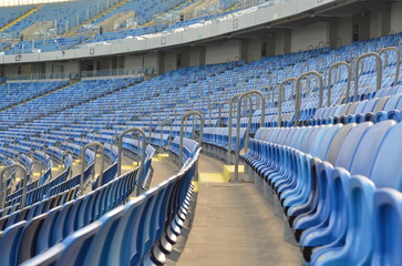 Naklejka premium the empty football stadium playground chairs