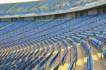 Naklejka premium the empty football stadium playground chairs