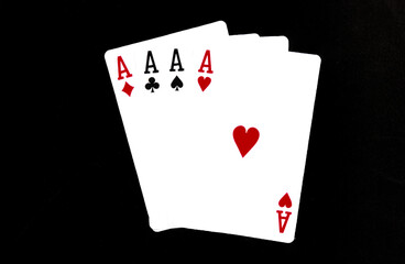 Royal playing cards on a black background.