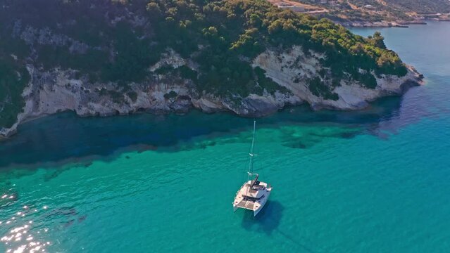 White catamaran boat on transparent water of ionian islands sea in Zakynthos
