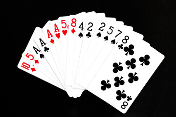 Royal playing cards on a black background.