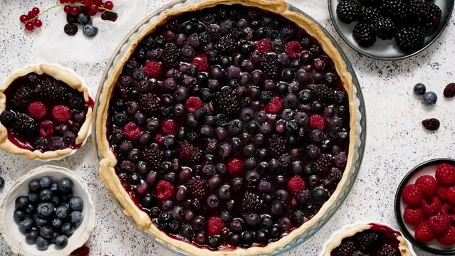 Sweet delicious homemade forest berry tart. Pie with blueberries and raspberries.