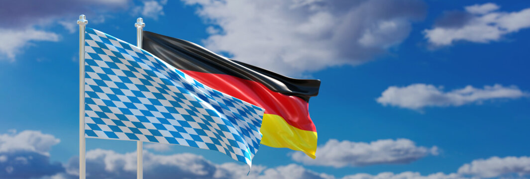 Oktoberfest template. Bavarian and German flag waving on blue sky, banner