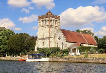 Fototapeta na wymiar Riverside English Village Church and Tower