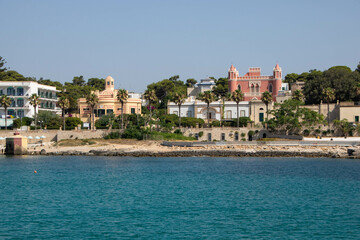 the town  Santa Maria di Leuca and liberty villas and traditional bagnarole  as seen from sea, Apulia region Italy
