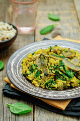 Mushrooms spinach turmeric brown rice in a plate