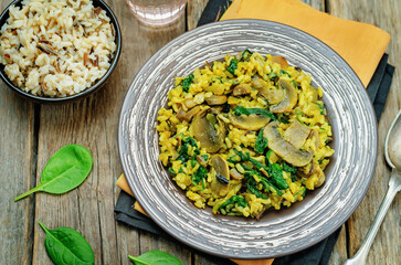 Mushrooms spinach turmeric brown rice in a plate