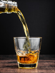 whiskey being poured into glass