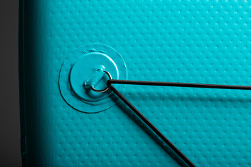 Elastic band with fasteners for luggage and things on the sapbood large.