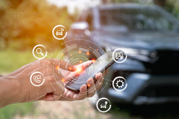 Car service and business on virtual screen concept, man uses smartphone to search for a car through...