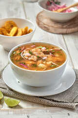 Encebollado, fish stew, served with banana and lemon fries. A typical Ecuadorian dish, Ecuadorian gastronomy