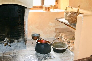 old fireplace on country house with baskets