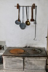 old kitchen utensils over kitchen oven