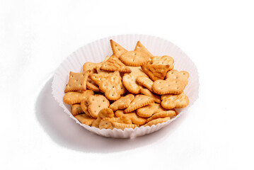 Dry salty cracker cookies on gray stone background.