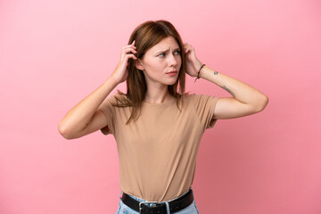 Young English woman isolated on pink background having doubts and thinking