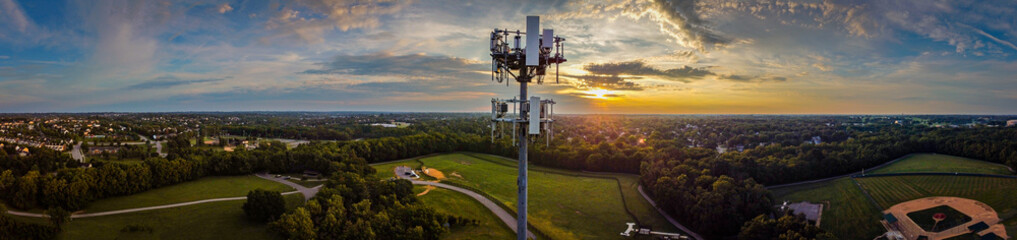 Panorama of mobile cell phone transmission tower on the hill of a park in the mid west city of...