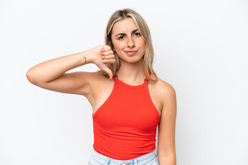 Young caucasian woman isolated on white background showing thumb down with negative expression