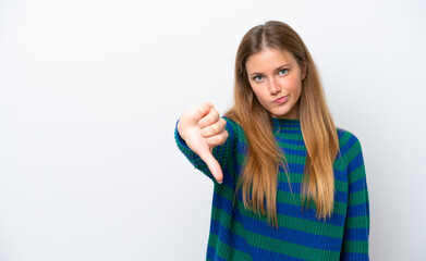 Young caucasian woman isolated on white background showing thumb down with negative expression